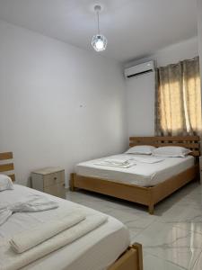 Postel nebo postele na pokoji v ubytování Hotel A & V Dodani