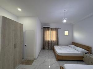 Postel nebo postele na pokoji v ubytování Hotel A & V Dodani