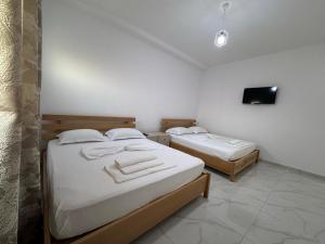 Postel nebo postele na pokoji v ubytování Hotel A & V Dodani