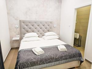 Posteľ alebo postele v izbe v ubytovaní Marina Baotić Apartments