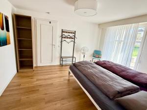 Postel nebo postele na pokoji v ubytování 2-Zimmerwohnung 46m2, nahe Zürich