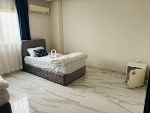 Postel nebo postele na pokoji v ubytování Zayed Hotel