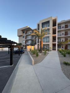 a sidewalk in front of a apartment building at Family-Friendly Oceanview Retreat Resort Access in Cabo San Lucas
