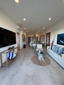 a living room with a couch and a table at Family-Friendly Oceanview Retreat Resort Access in Cabo San Lucas