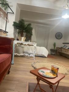 a living room with a couch and a table at Ô banc de la vigne in Fabrezan