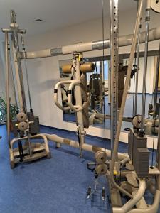 a gym with several treadmills and machines at Sternenacht in Sankt Englmar