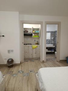 Kuchyň nebo kuchyňský kout v ubytování Sicily Rooms Appartamenti + 70 fotografií