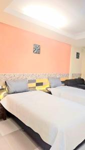 Ένα ή περισσότερα κρεβάτια σε δωμάτιο στο Jomtien Beach Apartment