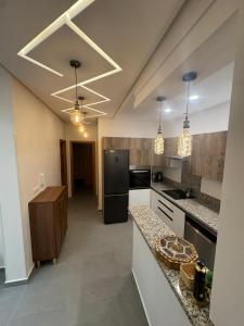 Η κουζίνα ή μικρή κουζίνα στο Appartement lux famille