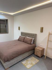 Ένα ή περισσότερα κρεβάτια σε δωμάτιο στο Appartement lux famille