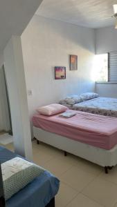 Ένα ή περισσότερα κρεβάτια σε δωμάτιο στο Pousada Recanto Bella Vista
