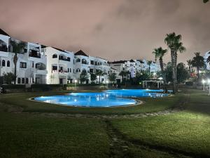a large swimming pool in front of a building at Cabo garden in Cabo Negro +25 photos