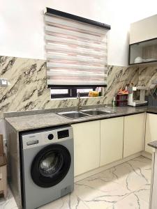 Kuchyň nebo kuchyňský kout v ubytování Luxury Duplex + 15 fotografií