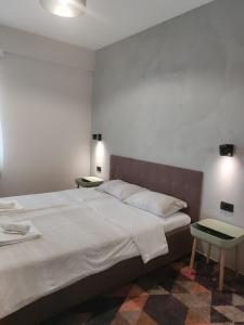 Ένα ή περισσότερα κρεβάτια σε δωμάτιο στο AmforA Apartment +30 φωτογραφίες