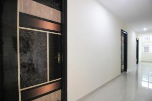 a door in a room with a wall at Collection O Stayo in Hyderabad