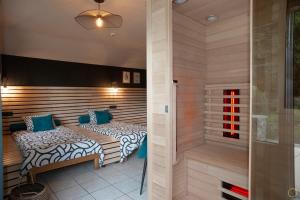 a sauna with two beds in a room at La Pastorale in Manhay +32 photos