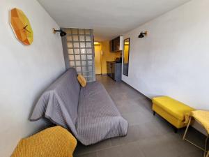 a living room with a couch and a kitchen at HappyEstate Apartments 3 min do Rynku in Wrocław +46 photos