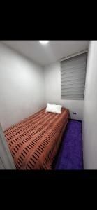 a bedroom with a bed with a pillow on it at Viña del Mar in Viña del Mar