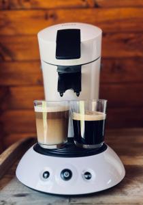 a coffee maker with two cups of coffee at La Bulle Armou 
