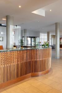 a lobby with a wooden fence in a building at Parador de Soria in Soria