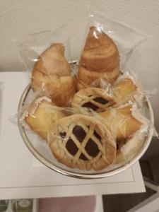 a bowl of pastries on a plate on a table at Profumo di Langa in Narzole +8 photos