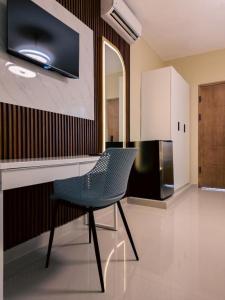 Soficu Hotel El Edén Dominicus的电视和/或娱乐中心