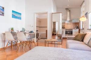 a living room and kitchen with a couch and a table at Copper House Altstadt Konstanz in Konstanz