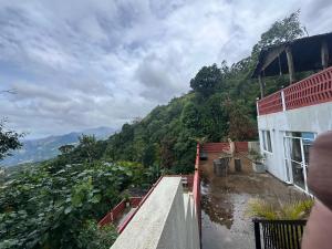 a view of a mountain from a house at Happiness Hill house in Rikillagaskada
