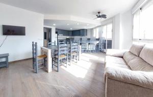 a living room with a couch and a table with chairs at Encantadora y acogedora casa in San Juan de Moró +13 photos