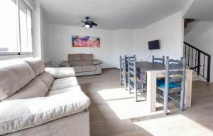 a living room with a couch and a table at Encantadora y acogedora casa in San Juan de Moró