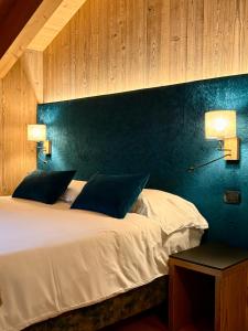 Voodi või voodid majutusasutuse Hotel Pedranzini toas +35 fotot