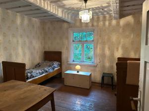 Ένα ή περισσότερα κρεβάτια σε δωμάτιο στο Retreat House