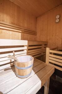 a bucket sitting on a table in a sauna at Chalet Magique - 4 stars - 4 bedrooms - center of Alpe d'Huez in LʼHuez