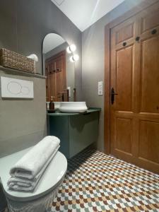 a bathroom with a toilet and a sink and a mirror at H&B COSTABLANCA in Villajoyosa +52 photos