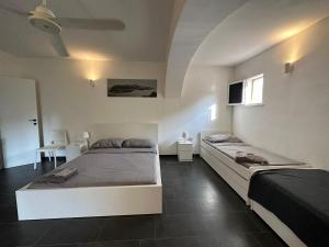 A bed or beds in a room at Casa Luvi