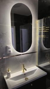 Koupelna v ubytování Apartament Szałwiowy i Ceglany z pięknym widokiem na miasto + 17 fotografií