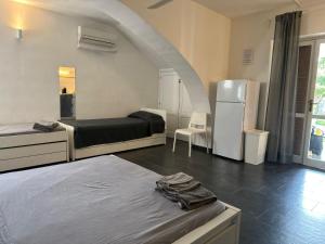 A bed or beds in a room at Casa Luvi