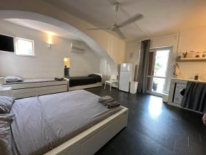 A bed or beds in a room at Casa Luvi