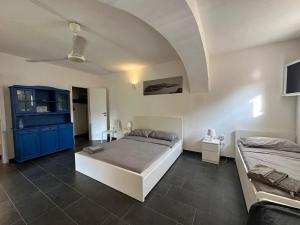 A bed or beds in a room at Casa Luvi