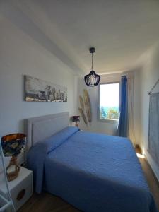 A bed or beds in a room at Dolci risvegli appartamento vista mare