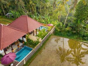 an aerial view of a villa with a swimming pool at Dukuh Sari Villa in Ubud