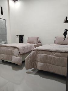 Кровать или кровати в номере Kana Geurute Homestay
