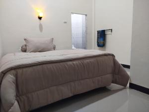 Кровать или кровати в номере Kana Geurute Homestay