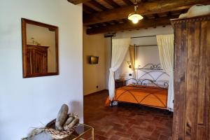 A bed or beds in a room at Agriturismo S. Apollinare