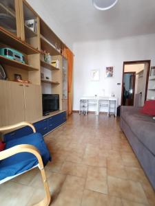 a living room with a couch and a table at AL40 - Turin Holiday Apartment in Turin