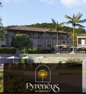 a view of a hotel with palm trees in the background at Pyrenéus Residence in Pirenópolis