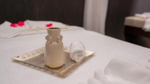 Ένα ή περισσότερα κρεβάτια σε δωμάτιο στο Zind Naaba Appart Hôtel