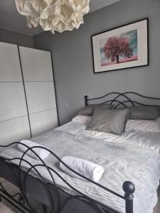Postel nebo postele na pokoji v ubytování Milanos apartament
