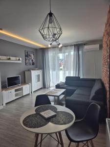 TV a/nebo společenská místnost v ubytování Milanos apartament
