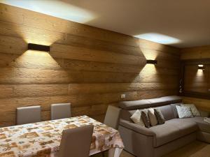 a living room with a table and a couch at I Dadi Cielo Alto cir VDA Valtournenche 0446 in Breuil-Cervinia